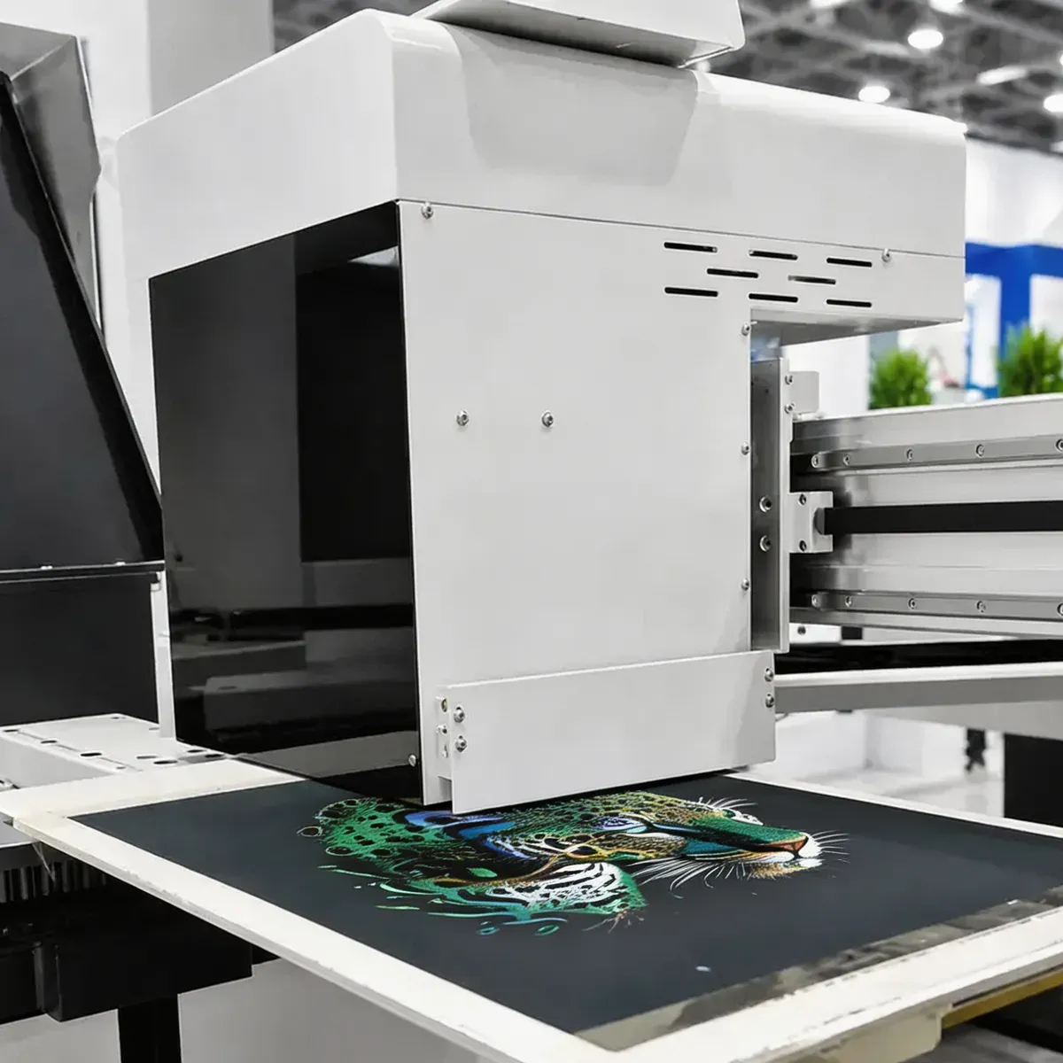 Epson i3200 printhead array laying down CMYKROGB+W pigment ink on All-in-One Hybrid DTG Printer