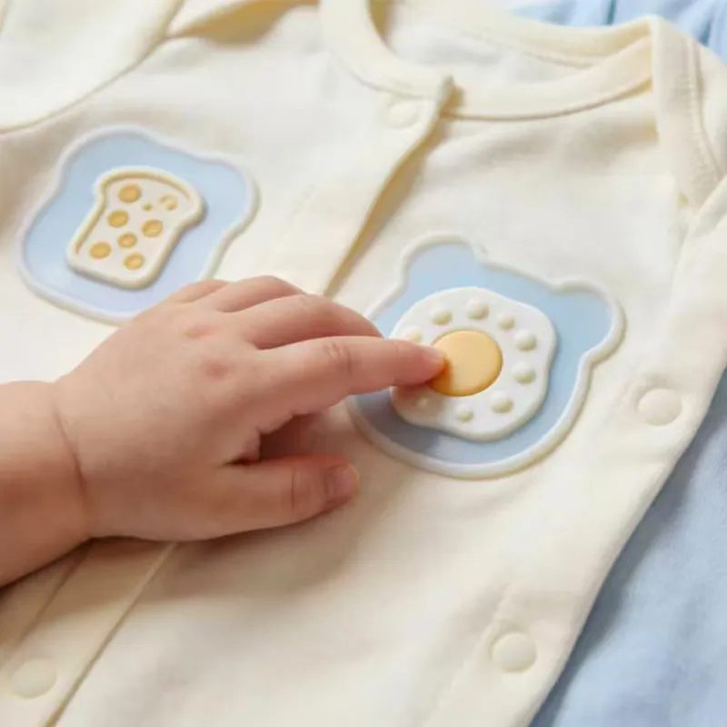 Soft-touch silicone HTV logos on kidswear garments